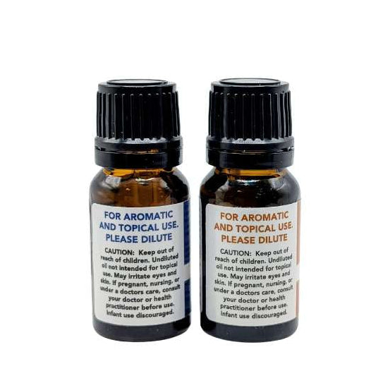 Two small bottles with black caps and labels on a white background