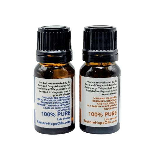 Two small bottles of 100% pure essential oils on a white background