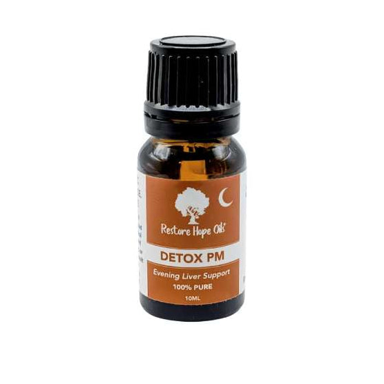 Bottle of Detox Duo PM oil with a brown label on a white background