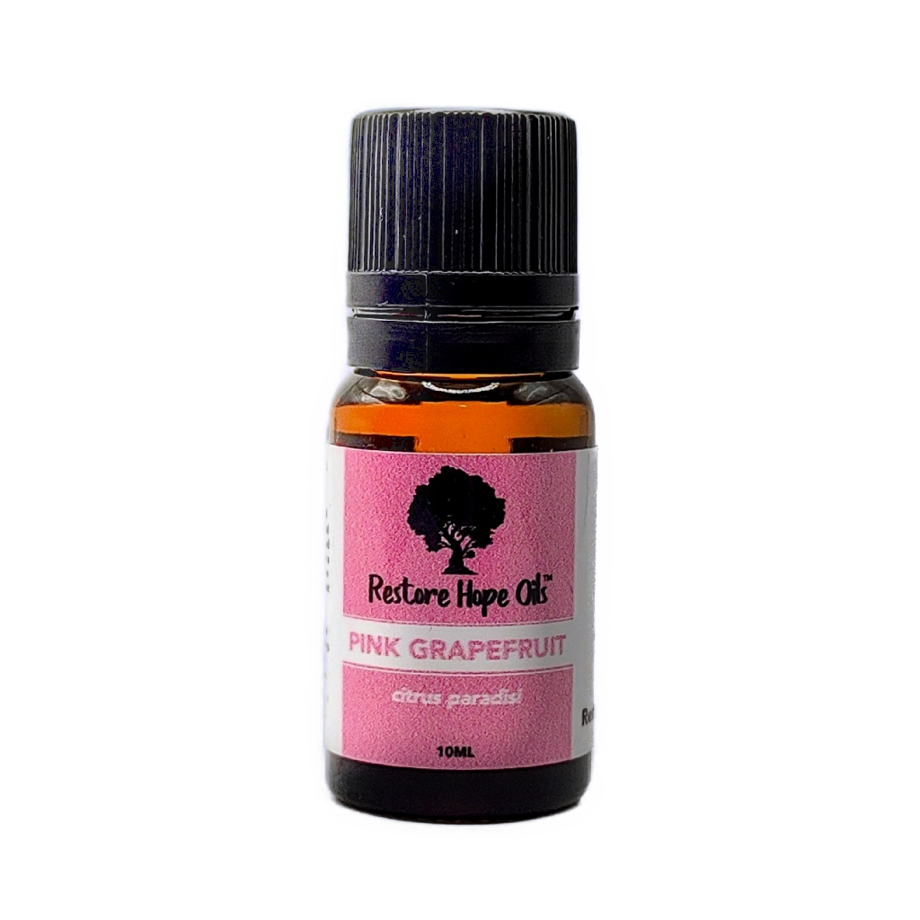 A 10ml bottle of Pink Grapefruit essential oil with a label that includes the brand 'Restore Hope Oils' and the Latin name 'Citrus paradisi'.